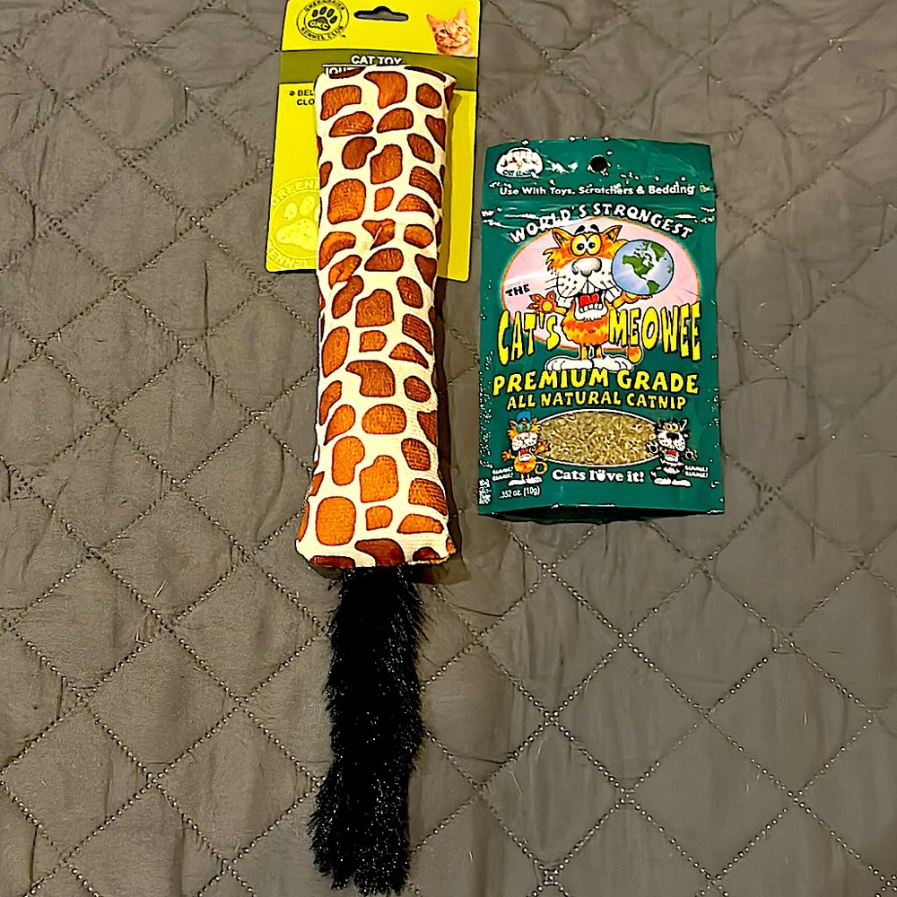 Giraffe print toy with faux fur has jingle bell inside